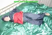 Get 548 Pictures with Jill tied and gagged in shiny nylon rainwear from 2005-2008!