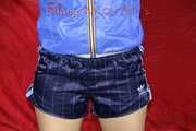 Watching sexy Sonja wearing a supersexy oldschool blue shiny nylon shorts and a lightblue rain jacket during her workout with barbells (Pics)