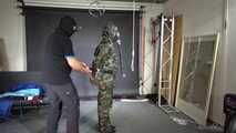 Ms Ungeniert tied and gagged in shiny nylon Rainwear 