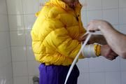Julia tied and gagged in a ski suit in the bath tub