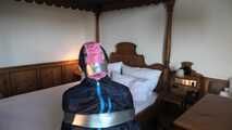 Rachel Adams bound, pantygagged and pantyhooded in shiny nylon Rainwear