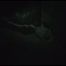 Jill tied, gagged and hooded on a cellar floor wearing a shiny green rain pants and a shiny black down jacket (Video)