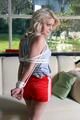 Nina tied and gagged in shiny red nylon shorts
