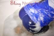 Watching Sonja taking a foam bath  wearing sexy blue shiny nylon rainwear (Pics)
