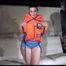 Sexy Jill shows you how to enjoy putting on and wear a lifevest over an bikini and a shiny nylon shorts (Video)