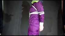 MARA tied and gagged overhead with ropes and a cloth gag wearing a super sexy super shiny purple rainsuit and blue rubber boots (Video)