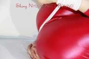 SEXY SANDRA being tied and gagged with ropes and a ballgag on a sofa wearing a SUPERSHINY NEW RED NYLON PANTS and a rain jacket (Pics)