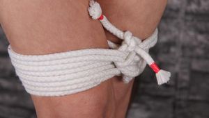 Naked girl tied to the stake