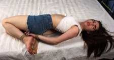 Doris hogtied on bed