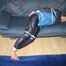 Katharina tied, gagged and hooded (breath control) on a sofa wearing sexy blue shiny nylon rainwear (Pics)