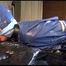 Pia tied, gagged and hooded in bed wearing a sexy blue AGU rainwear combination (Video9