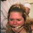 BBW MICHELLE'S IS MOUTH STUFFED, VET TAPE WRAP CLEAVE GAGGED, CHAIR TIED, BAREFOOT & WEARING A SATIN BLUE SLIP (D59-4)
