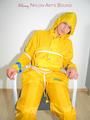 Katharina tied, gagged and hooded on a chair wearing sexy yellow rainwear (Pics)