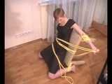 Alice Lee - Dress-wearing beauty gets tied to a table and escapes (video)