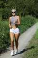 Watch Chloe enjoying her shiny nylon Shorts outside at a sunny Day