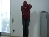 Video with one of our archive girls tied and gagged in shiny nylon rainwear