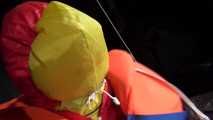 Watching Jill wearing a sexy shiny nylon rain pants and three shiny nylon rain jackets and a life jacket being tied and gagged and HOODED three times (Video)