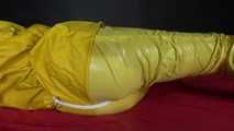 Watching sexy Pia being tied and gagged with ropes on a bed and a clothgag wearing sexy yellow shiny nylon rainwear (Video)