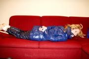 Samantha bound and gagged in a shiny nylon down coat