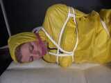Watch Pia enjoying Bondage in her shiny nylon yellow Rainwear