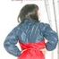 Stella wearing a red shiny nylon rain pants and an oldschool blue/red rain jacket while posing in the living room (Pics)