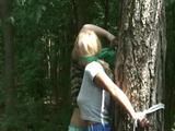 An archive girl tied and gagged on a tree by Jill both wearing shiny nylon shorts (Video)
