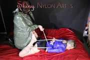 Watching sexy Sonja wearing a sexy shiny nylon shorts and a rain jacket being tied from Miss D with ropes (Pics)