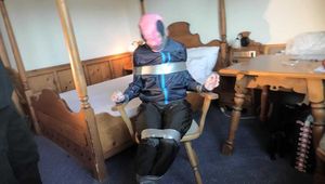 Rachel Adams bound, pantygagged and pantyhooded in shiny nylon Rainwear