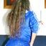 Petra posing infront of the sofa wearing sexy shiny nylon shorts and rain jacket (Pics)