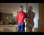 Watch Sonja to dress herself with rainwear and begin her workout on the home trainer (Video)