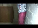 Nicole tied and gagged in a beautiful shiny silver/red PVC suit by Sophie in the cellar (Video)