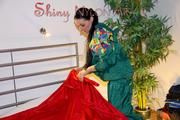 Lucy putting on linen on bed wearing supersexy green shiny nylon rainwear (Pics)