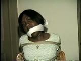 BLACK BANK TELLER IS MOUTH STUFFED, CLEAVE GAGGED & ROPE TIED TO CHAIR  (D46-2)