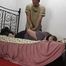 Ginger in hogtie on bed 1/2