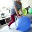 Angie is pumping up some balloons and pop them