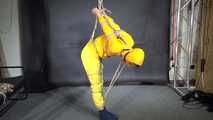 Marie tied and gagged in shiny nylon rainwear