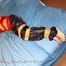 one of our archive girls tied and gagged in shiny nylon rainwear
