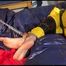 Sonja tied, gagged and hooded on bed with tape wearing a supersexy yellow rainwear combination (Video)