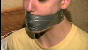 PUNK GIRL MELA GETS WRAP TAPE GAGGED, DUCT TAPE TIED, BAREFOOT, TOE TIED WITH TAPE & GAG TALKS (D60-8)