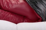 Samantha tied and gagged on a white sofa wearing a shiny red down pant and a black down jacket (Pics)
