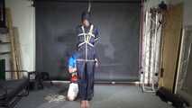 Myxxxy bound and gagged in a shiny nylon Rainsuit