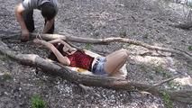 Nelly tied between two trees 1/2