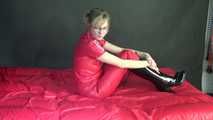 ***NEW MODELL MIA*** wearing a sexy red shiny nylon catsuit and black shiny rubber boots with heels during preparing her bed (Video)