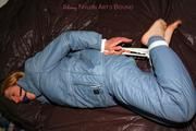 Katharina tied and gagged in a blue skisuit