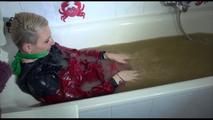 Mara sitting in her bathtub wearing a sexy shiny nylon shorts and a rain jacket while bounding herself (Video)