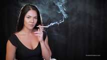 Delicious lady Tanya is engrossed in smoking a 120mm cigarette