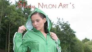 Watching ***OUR SEXY ARCHIVE MODEL JENNY*** wearing a sexy white shiny nylon shorts and a green shiny nylon rain jacket posing for you (Pics)