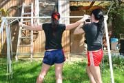 Jill tied and gagged by her friend in shiny nylon shorts