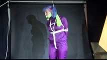 MARA tied and gagged overhead with ropes and a cloth gag wearing a super sexy super shiny purple rainsuit and blue rubber boots (Video)