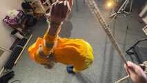 Marie tied and gagged in shiny nylon rainwear